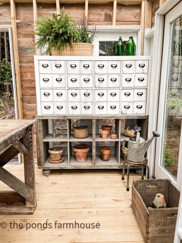 IKEA 16-Cube Storage Unit transformed into an apothecary Cabinet/ Card Catalog Cabinet for greenhouse.