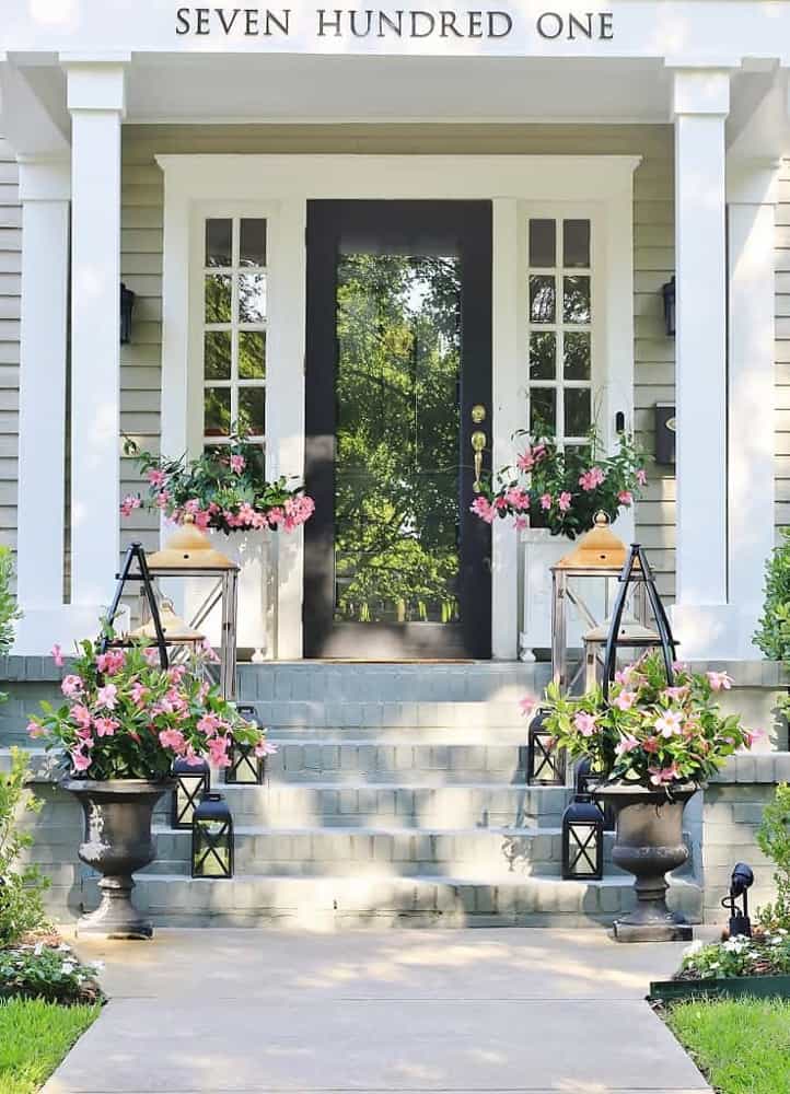 Outdoor spaces decorating ideas. Front porch planters. Glass front doors. Planter boxes on front porch.