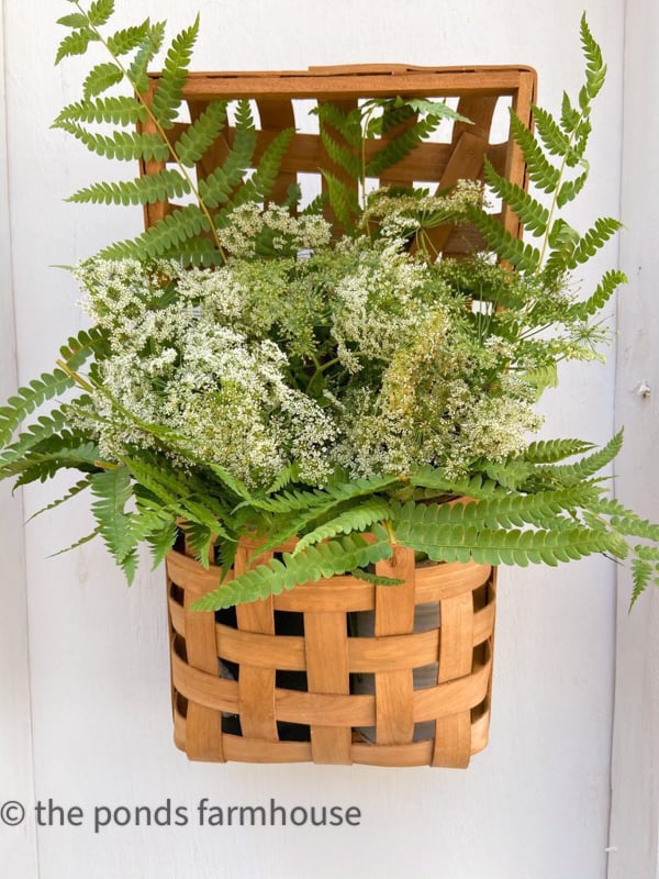 Wall basket filled with free wildflowers for a FREE Queen Anne's Lace & Wild Fern Floral Arrangement