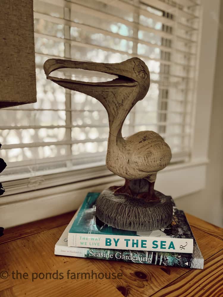 Stack of coastal books add beach vibe to any home for a great coastal decor idea. Beach Decor 