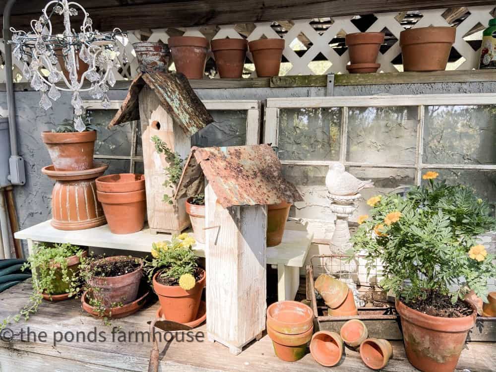 How to build birdhouses from scrap materials on DIY potting bench with clay pots and old reclaimed windows