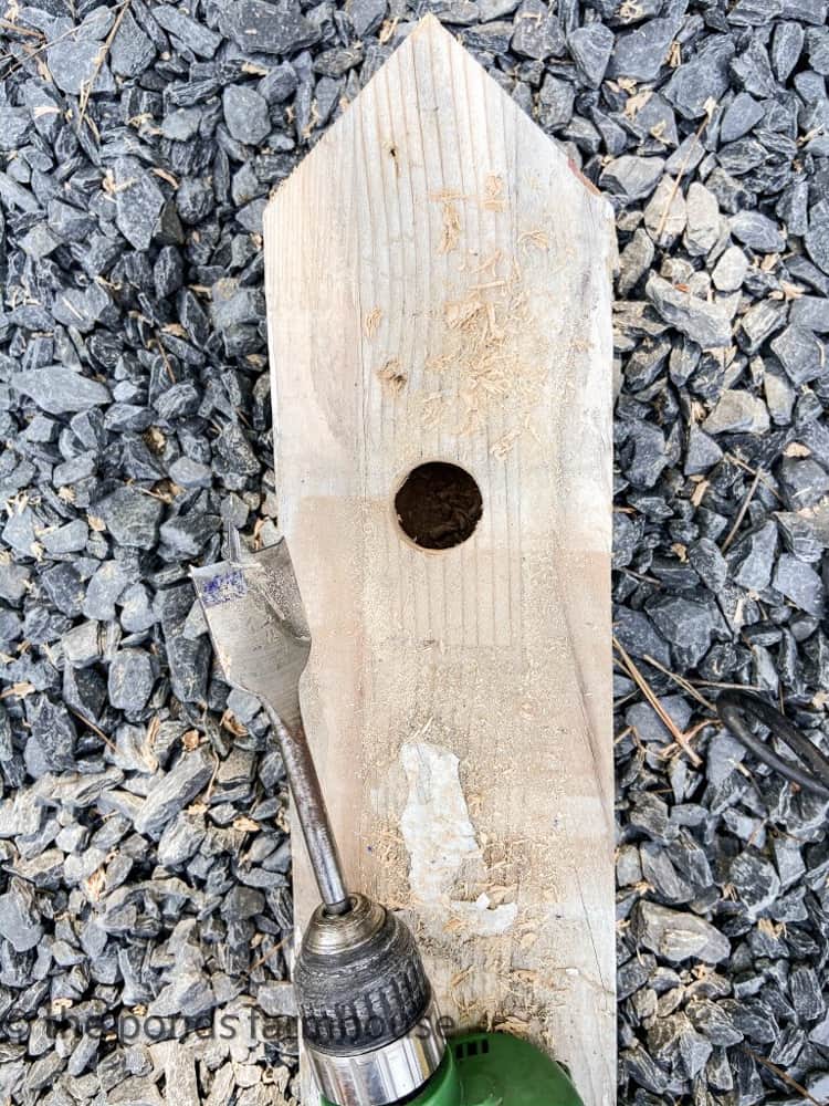 Drill hole for a faux birdhouse.