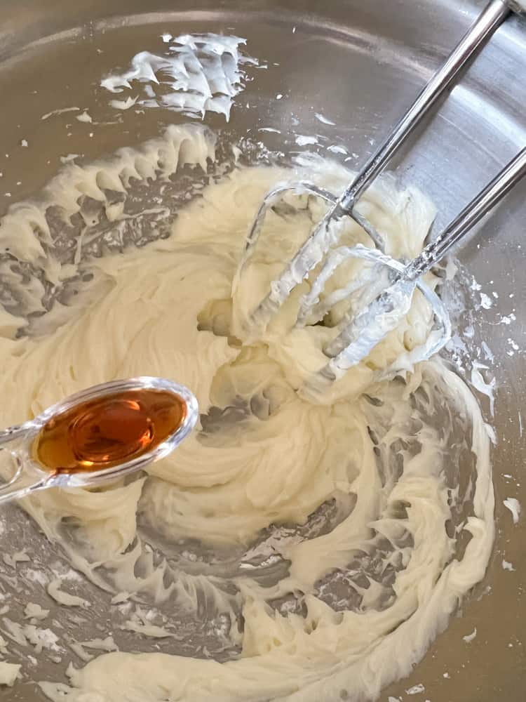 Add vanilla extract to the filling mixture in mixing bowl