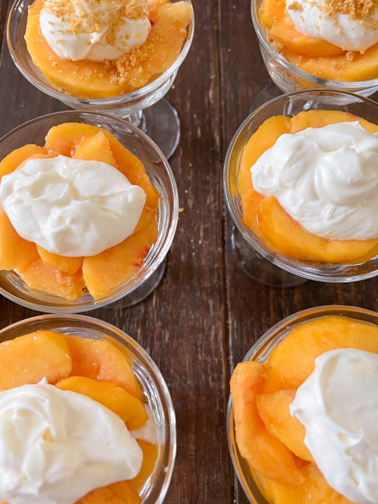 Fresh Peaches topped with creamy whipped topping made from whipping cream and cream cheese icebox dessert