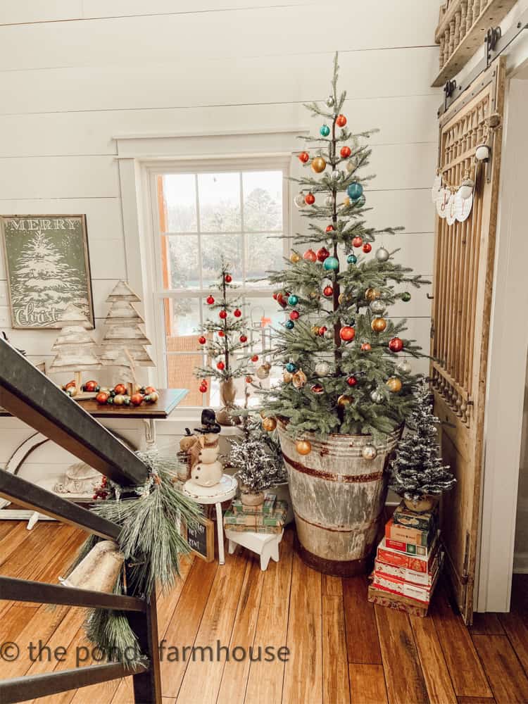 Shiny Brite Ornaments on a minimal Tree in a Vintage Grape Hod Stand.  