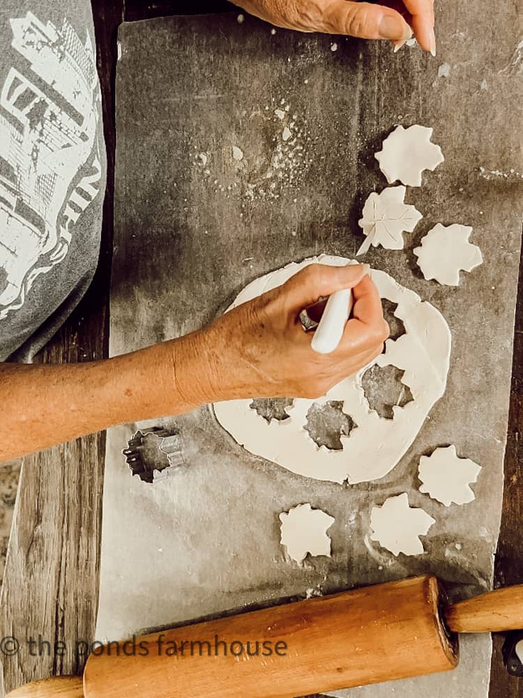 Cut veins in maple leaves with paring knife on air dry clay ideas for napkin rings.  