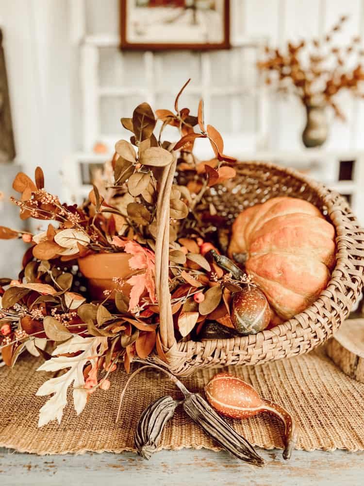 Ideas for Fall Baskets - Add clay pot, pumpkins and fall flowers to basket for unique centerpiece ideas for Autumn