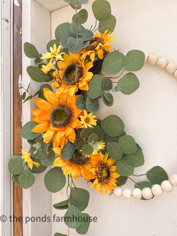 Beaded Wreath with Sunflowers and Eucalyptus leaves showcase the sunflower colors.  