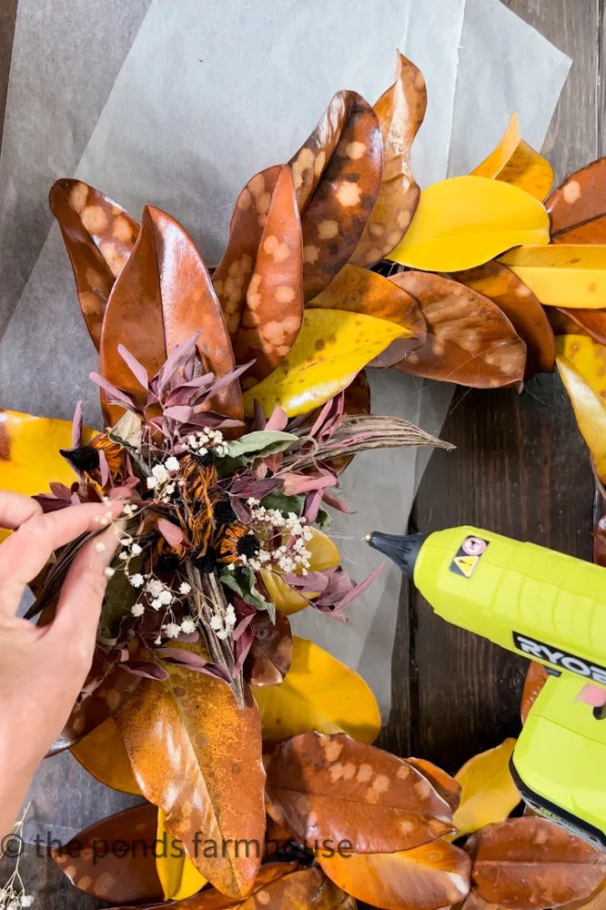 Use Hot Glue To attached dried flowers to DIY Fall Wreath.  Budget Friendly Wreath Idea. 