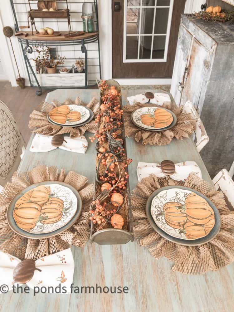 Farmhouse Table Setting with DIY Packing Material Plate Charger's and pumpkin centerpiece. Trash to Treasure Decor