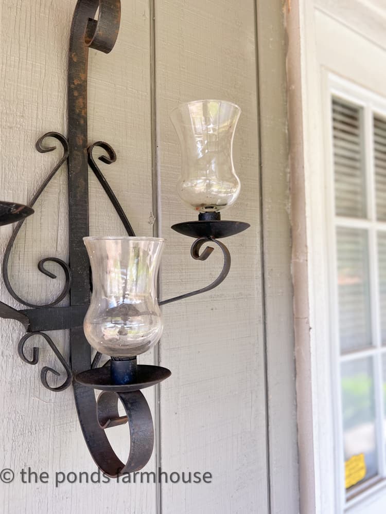 Vintage Thrift Store Wrought Iron Scones flank the workshops front door.  