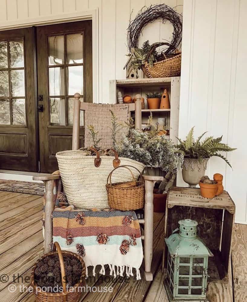 Front Porch filled with rocker, foraged basket of gum balls from sweet gum ball tree and other items that you hunt and gather.  