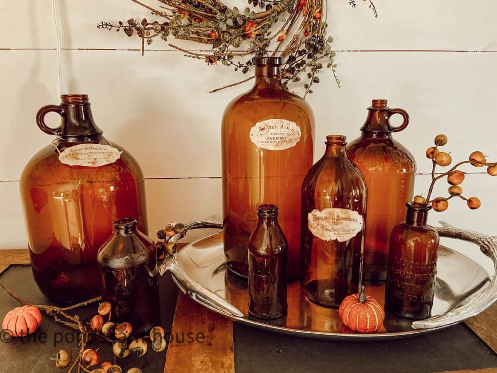 The Secret to making a label for a bottle to look like a vintage jar label. Vintage Amber bottle on silver tray