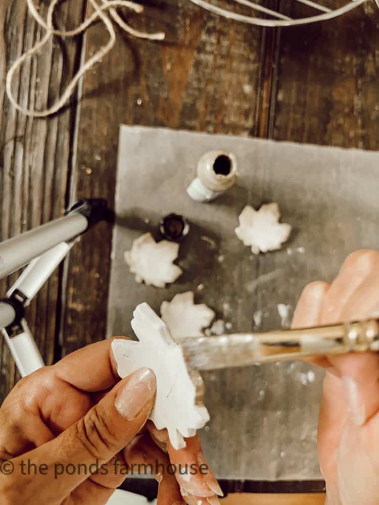 Paint with antique metallic gold to highlight edges of the air dried clay leaves.  