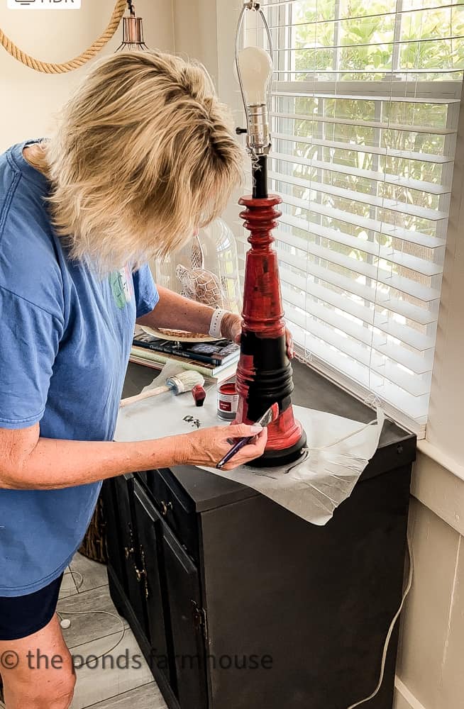Paint lamp base red with chalk paint for a coastal lamp makeover and repurposed transformation. 