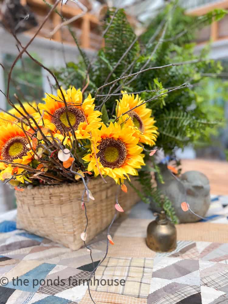 Sunflower Symbolism - sunshine, happiness and longevity.  Basket filled with faux sunflowers.