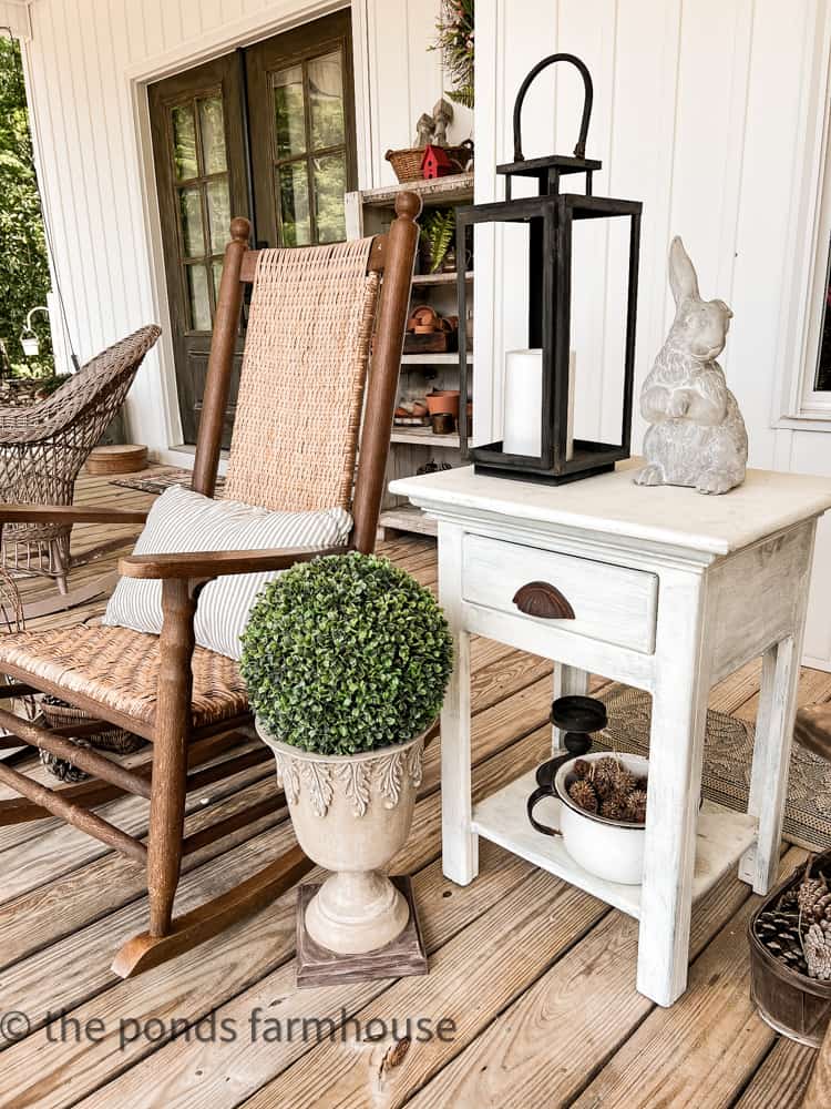 Thrifted Rocker and side table work well together on Front Porch with lantern and faux boxwood in urn.  