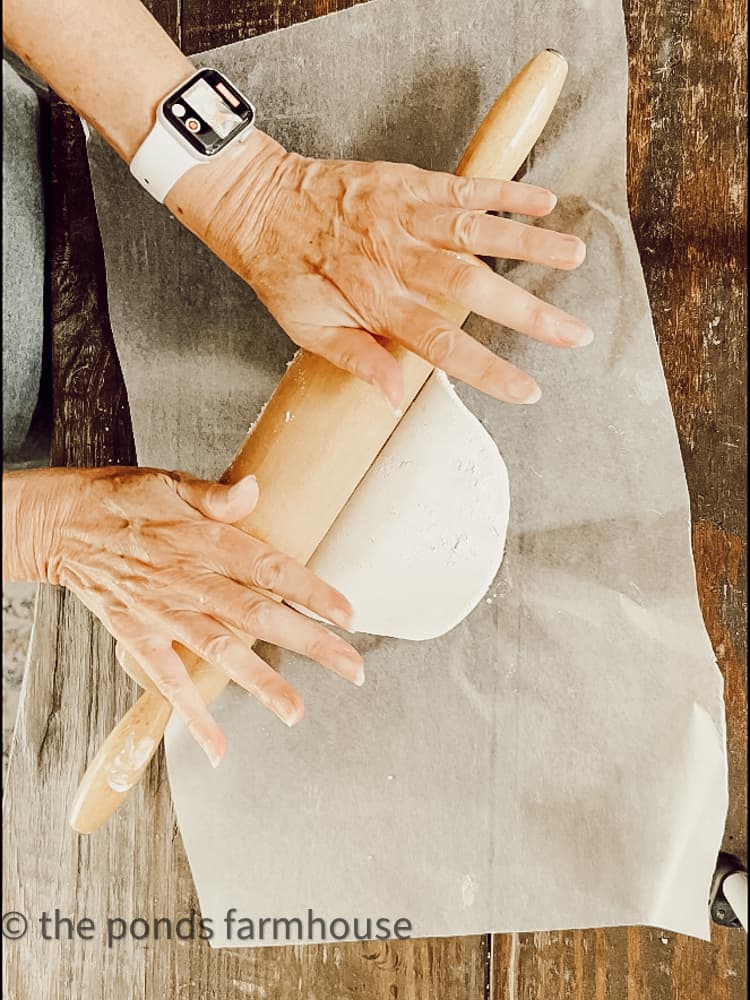 Roll out air dry clay with rolling pin. 