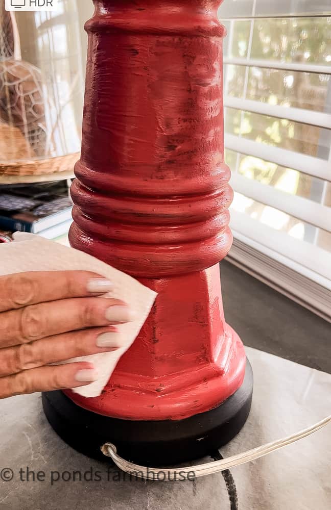 Distress lamp base by wiping off excess paint will give your old lamp new life with easy DIY tips
