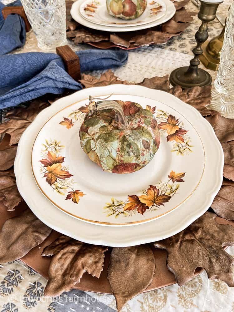 Thrifted Home Decor Trends for Fall 2023.  thrifted leaf plates with napkin decoupage pumpkins.  
