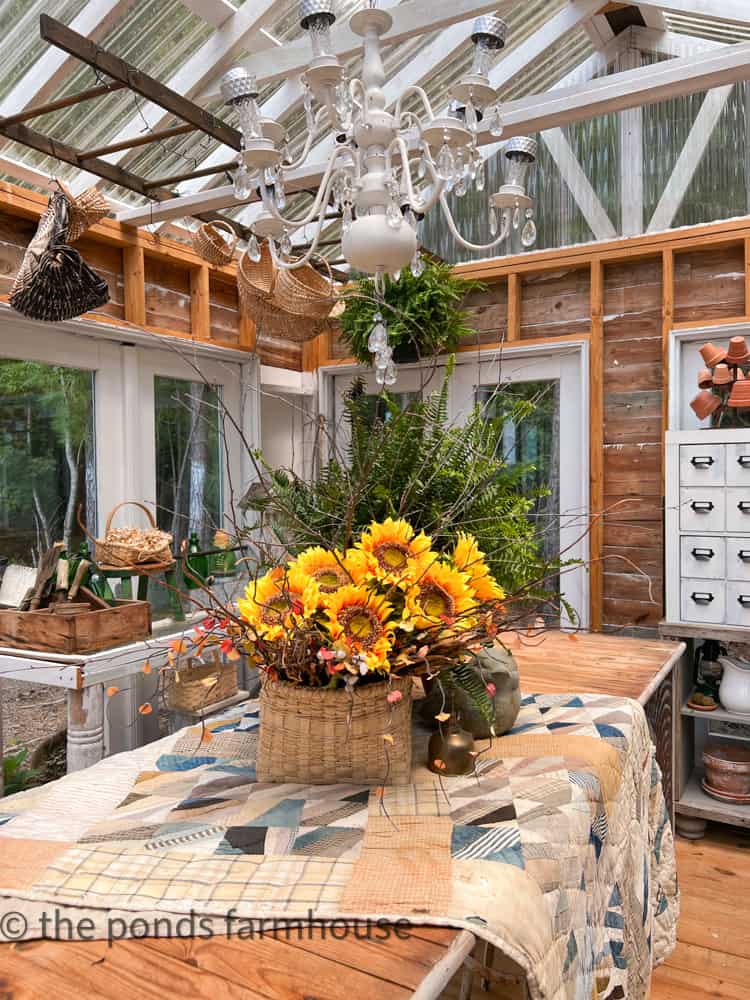 Sunflower and ferns on Greenhouse/She-shed center table. 