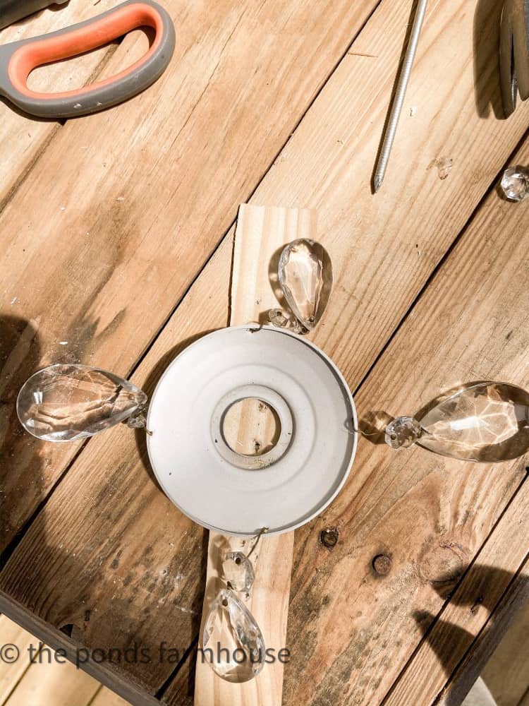 Add vintage chandelier crystals to repurposed chandelier