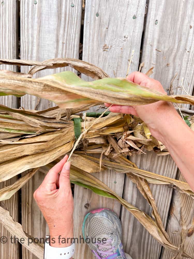 Assemble corn stalks to make a farmhouse style garland for front porches or doorways