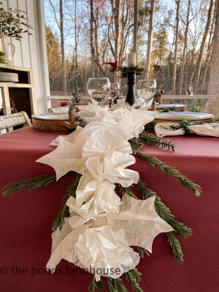 Inexpensive Christmas Garland made with Coffee Filters for a feastive holiday table runner.