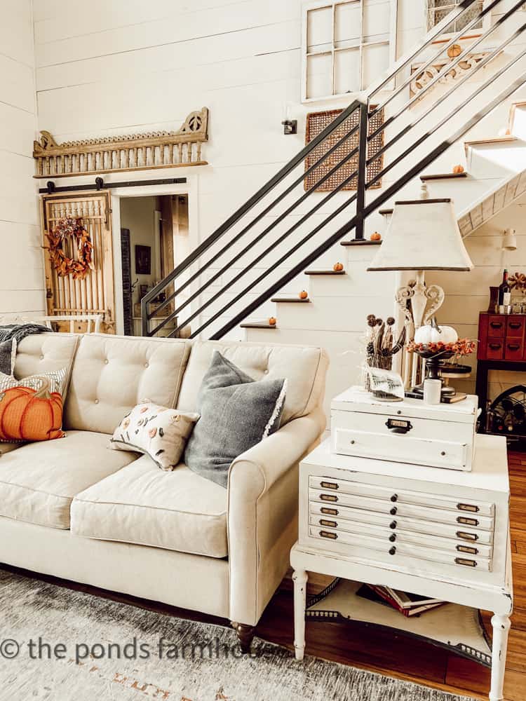 Repurposed table and chest.  DIY Scrap Fabric Pillow Cover in Living Area of Industrial farmhouse.  