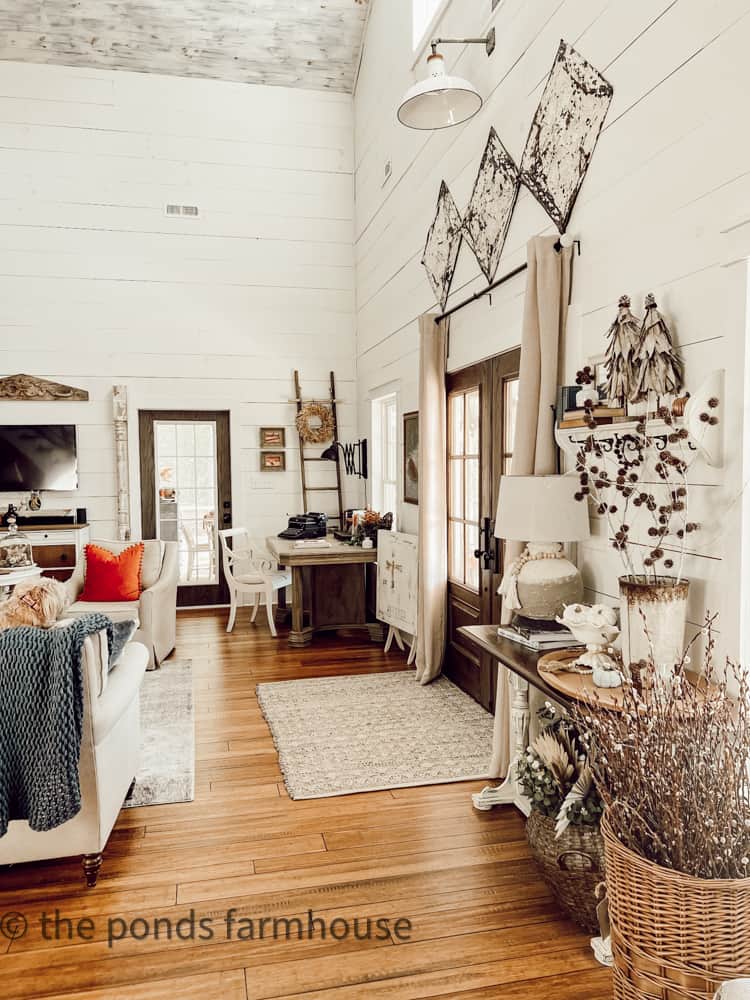 Entry to Industrial Farmhouse with vintage ceiling tiles and french doors.