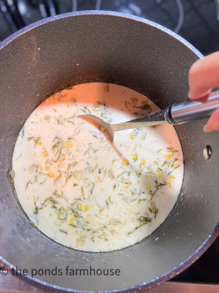 Simmer ingredients in Fish Chowder. 