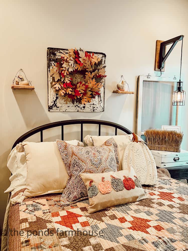 Dollar Tree Leaf Fall Wreath Matches the yard sale quilt added to the guest bed. 