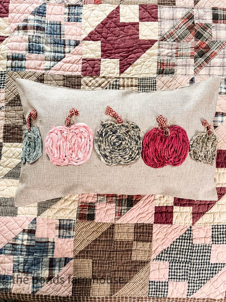 Make custom pillow covers by upcycling fabric scraps for a no-sew unique pumpkin pillow cover.