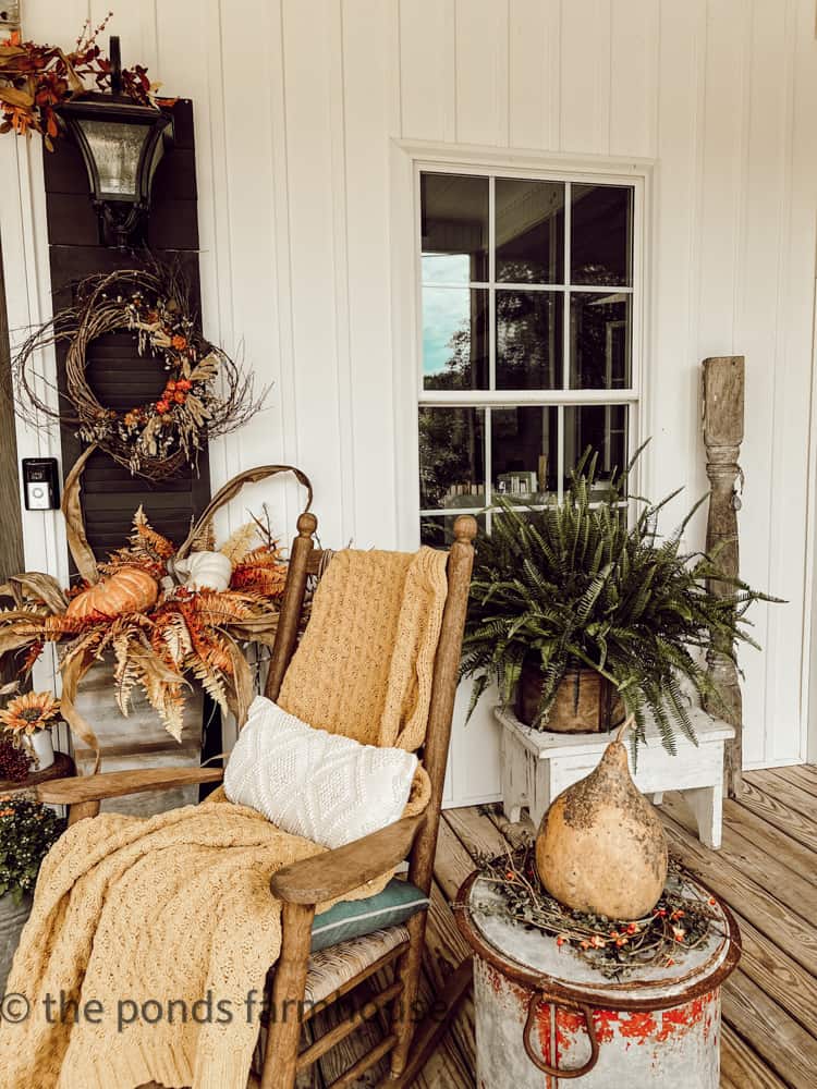 Cozy rocking chairs and throw blankets by front doors