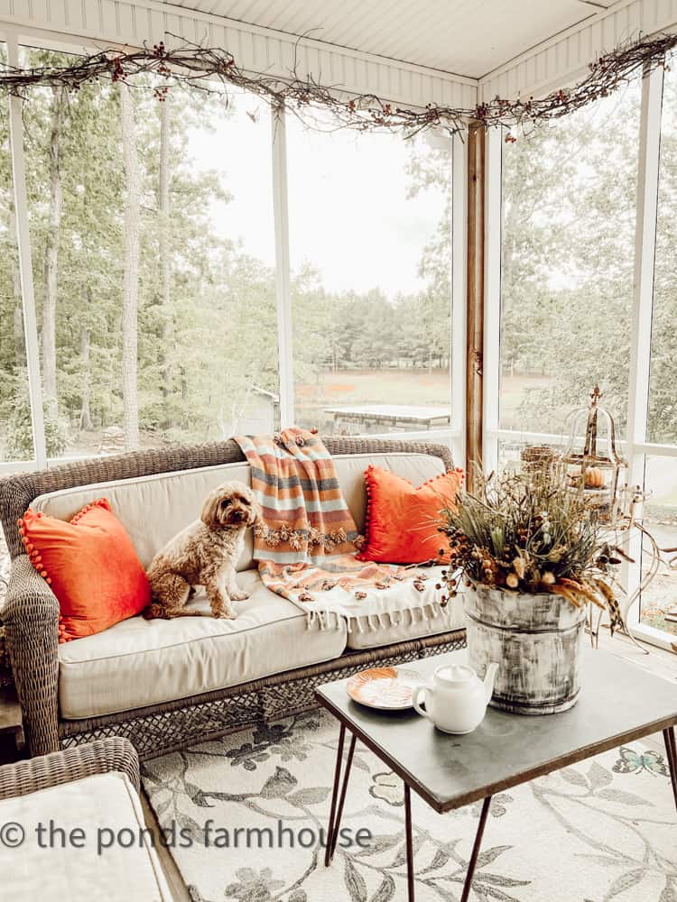 Cozy Seating on the Screened-in porch decorated for fall