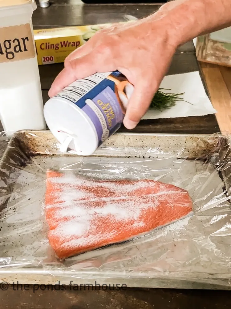 Add salt to salmon for cured smoked salmon recipe