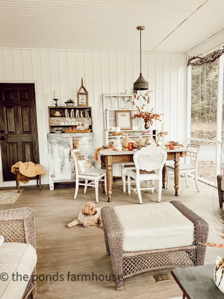 Screened Porch Dining Area with Fall Tablescape, vintage icebox, diy light fixture.  