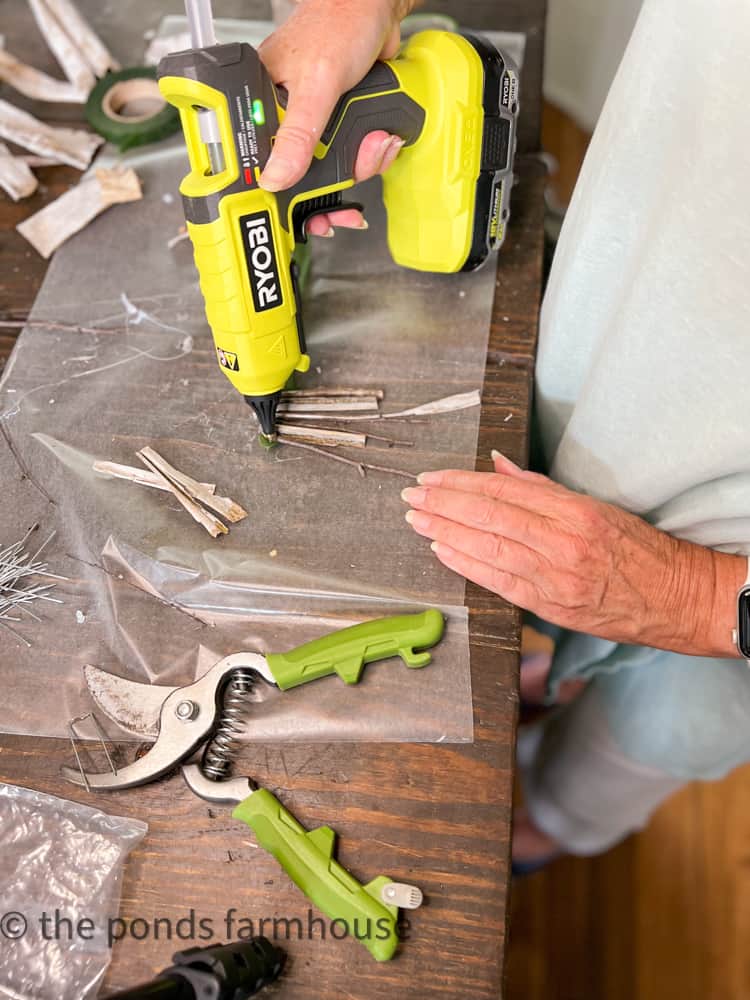 attach twigs to floral tape for a cheap and easy cottage style fall craft.