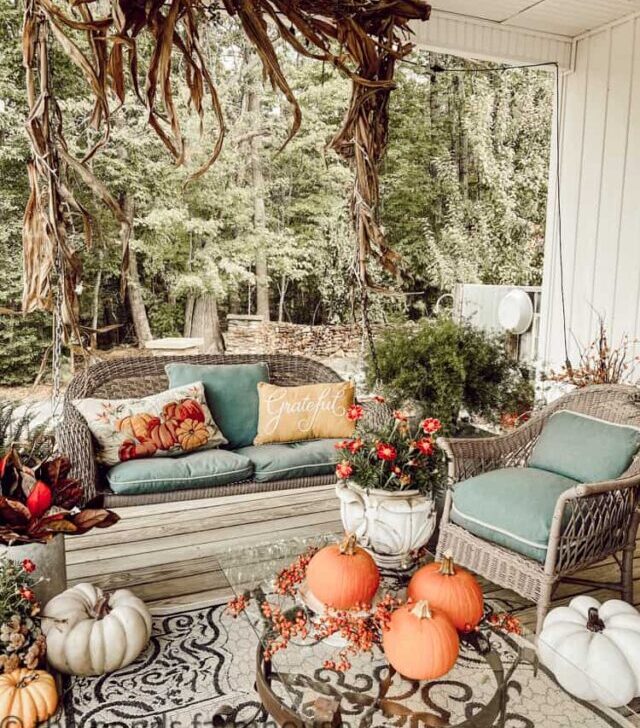 cropped-Coffee-Table-with-pumpkin-and-porch-swing-with-corn-stalks-Cozy-Front-Porch-Ideas-for-Fall.jpg