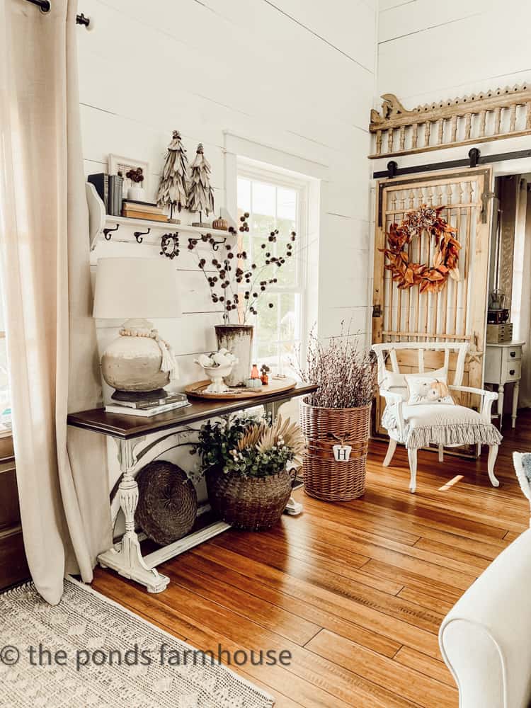 Entry table in modern farmhouse decorated with DIY corn stalks topiaries & DIY Sweet Gum Ball Stems