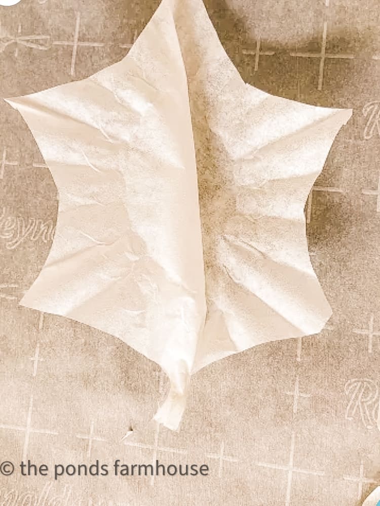 fold coffee filters to look like holly leaves
