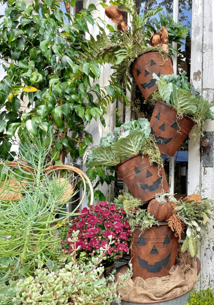 DIY Rusted Bucket Jack-o-lantern topiary for your garden.