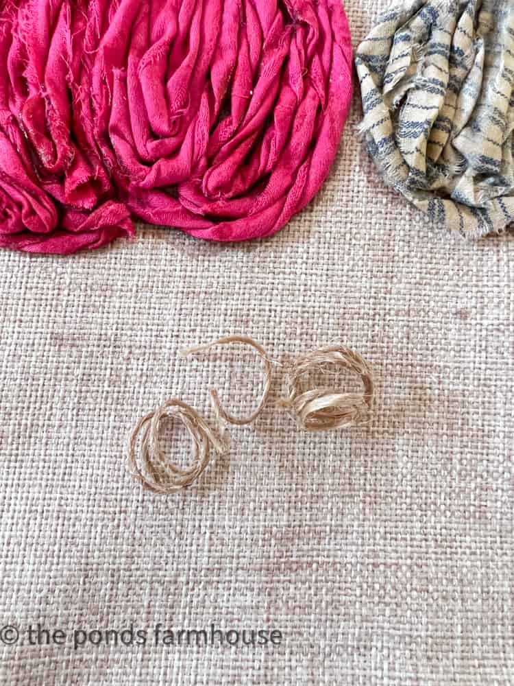 Jute twine curls are optional for the scrap fabric pumpkin pillow cover. 