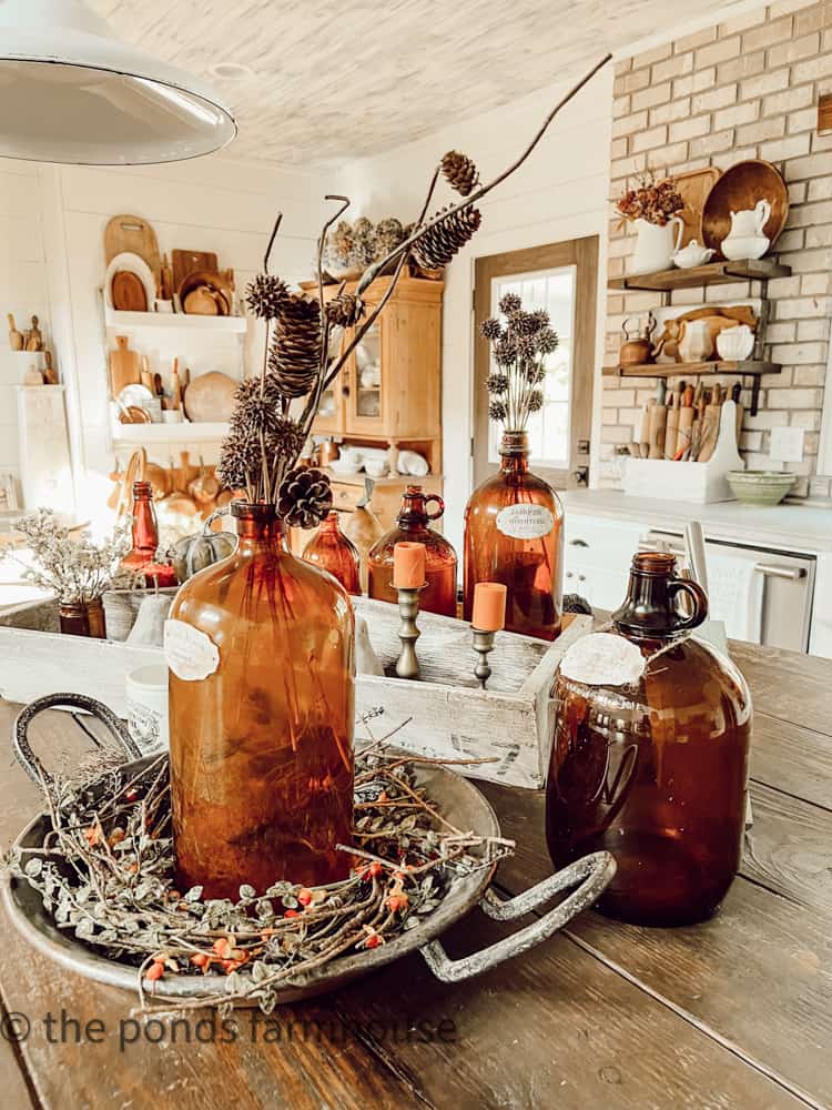 Vintage Amber Bottles create a unique vignette on DIY Kitchen Island in Farmhouse Kitchen Home Tour