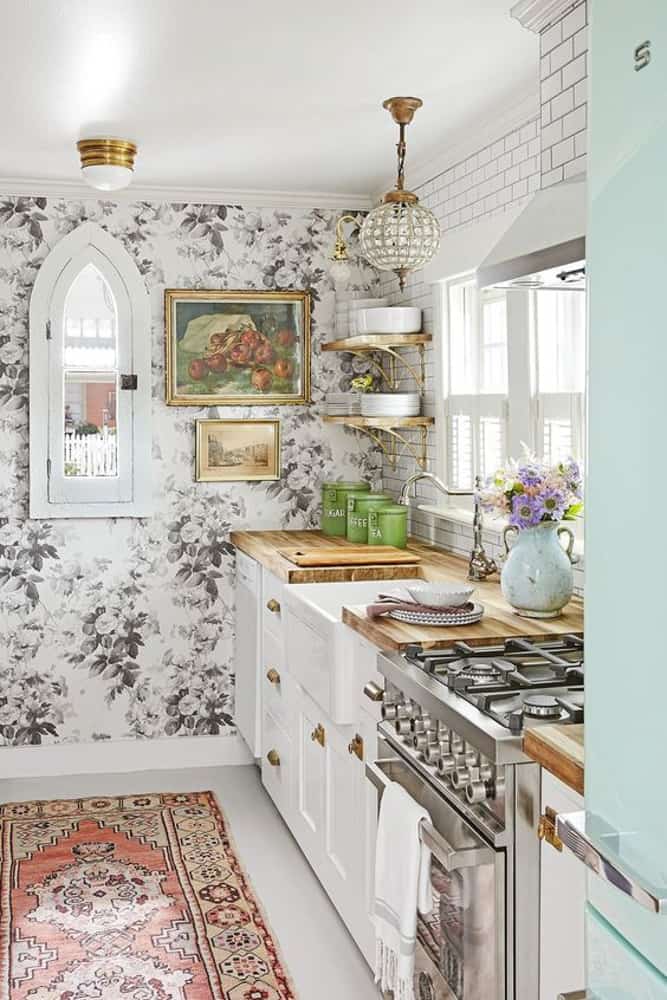 This floral wall paper has a french country feel in this modern farmhouse kitchen style.  