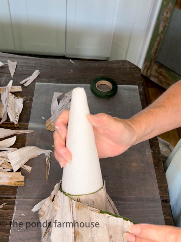 Wrap cone with corn husks to create a fall farmhouse style topiary.  