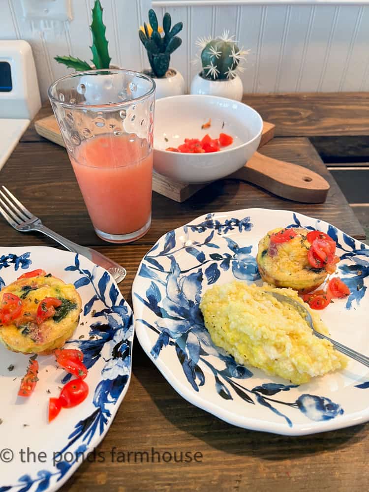 muffins on plate with grapefruit juice and grits