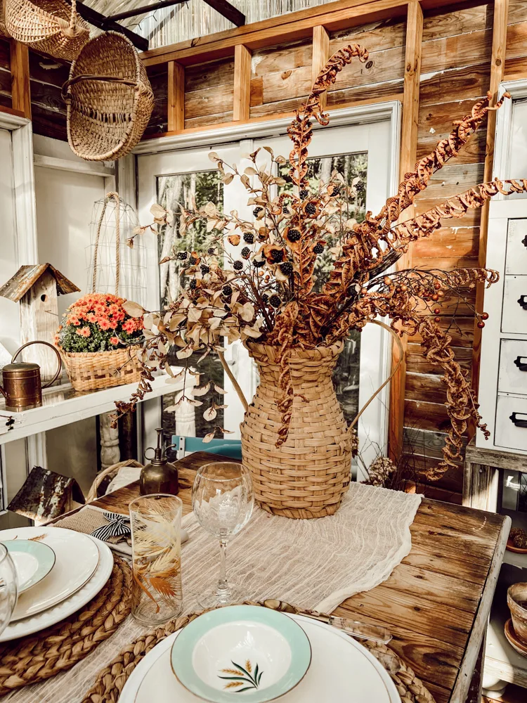 Dried Floral Arrangement in thrift store woven basket vase on Friendsgiving Brunch Table Setting