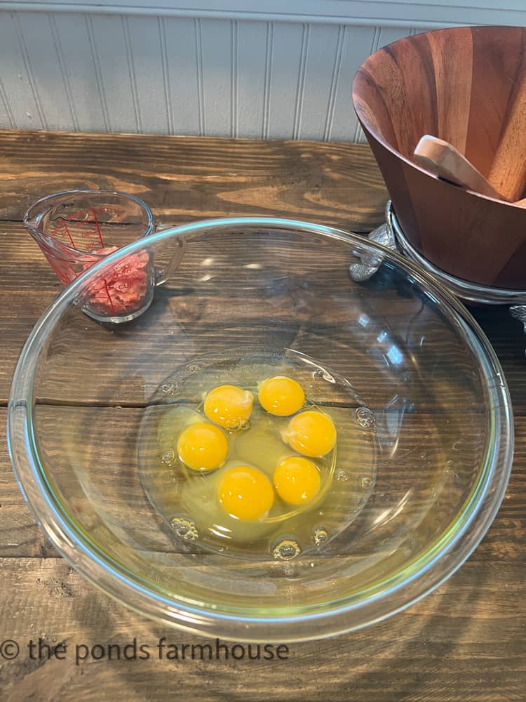 six eggs in mixing bowl