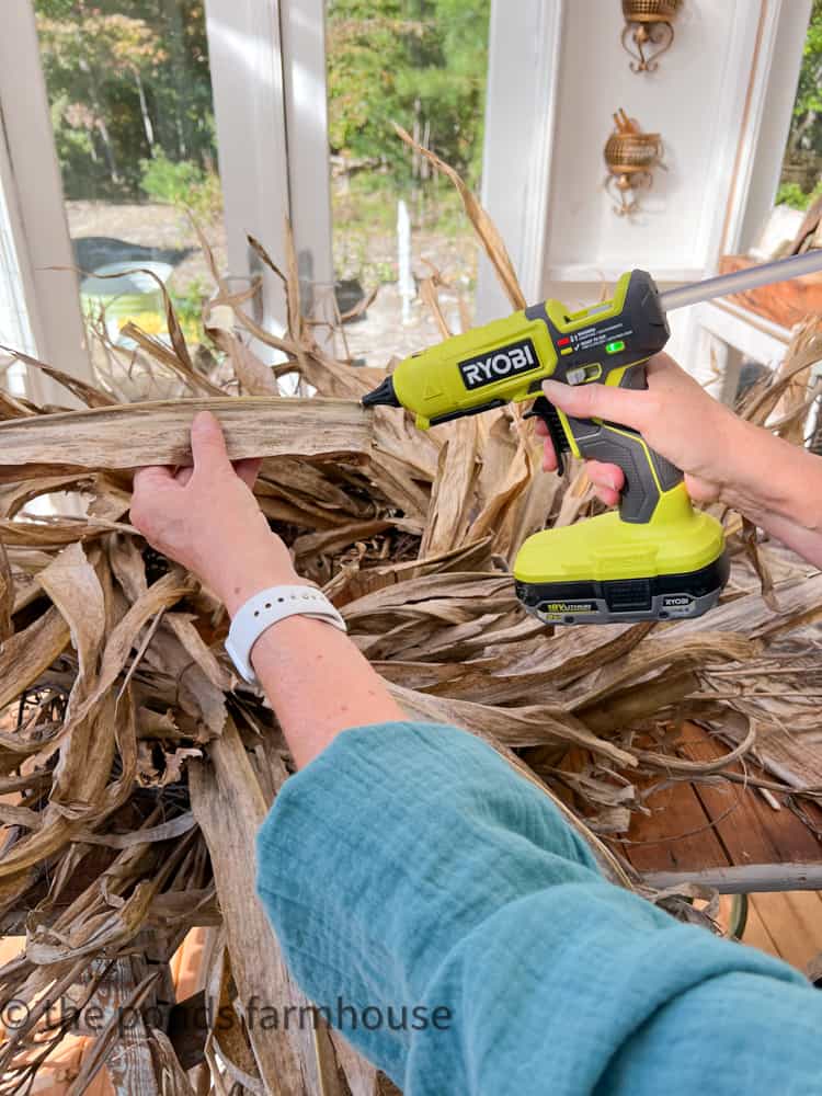 Hot glue corn husk to fill in wreath